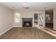 View of living room featuring wood floors and fireplace at 1184 Red Oak Cv, Tucker, GA 30084