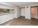 Inviting living room with sleek wood floors and a view into the kitchen and bathroom at 1184 Red Oak Cv, Tucker, GA 30084