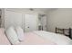 Bedroom with closet and bed, featuring pillows and a white quilt at 2060 Clairmeade Ne Way, Atlanta, GA 30329