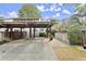 Attached carport and storage area in front of the townhome in a residential neighborhood at 2060 Clairmeade Ne Way, Atlanta, GA 30329