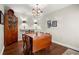 Traditional dining room with hardwood floors, vintage cabinet, and classic chandelier lighting at 2060 Clairmeade Ne Way, Atlanta, GA 30329