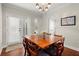 Cozy dining area with hardwood floors, natural light, and access to outdoor space through French doors at 2060 Clairmeade Ne Way, Atlanta, GA 30329