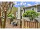 Exterior showcasing a fenced-in back area with greenery and visible AC units at 2060 Clairmeade Ne Way, Atlanta, GA 30329