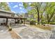 Spacious carport and exterior front of townhome with landscaping and green space at 2060 Clairmeade Ne Way, Atlanta, GA 30329