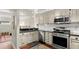 Well-equipped kitchen boasts stainless steel appliances, subway tile backsplash, and dark countertops at 2060 Clairmeade Ne Way, Atlanta, GA 30329