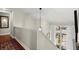 Upstairs landing features a modern light fixture and a window with abundant natural light at 2060 Clairmeade Ne Way, Atlanta, GA 30329
