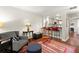 Inviting living room with open layout to the kitchen, featuring barstool seating and stylish furnishings at 2060 Clairmeade Ne Way, Atlanta, GA 30329
