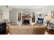 Comfortable living room with stone fireplace, plush sofa, and views of the outdoor space at 2060 Clairmeade Ne Way, Atlanta, GA 30329