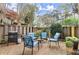 Backyard patio features an outdoor seating area and grill surrounded by a wooden fence at 2060 Clairmeade Ne Way, Atlanta, GA 30329