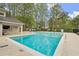 Community pool featuring clean water, concrete deck, and adjacent pool-house at 2060 Clairmeade Ne Way, Atlanta, GA 30329