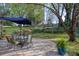 Large backyard combines a stone patio, dining table, and lush lawn at 2415 Carina Nw Ter, Acworth, GA 30101