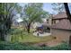 Expansive backyard featuring a patio, mature trees, and lush landscaping, perfect for outdoor living and entertaining at 2415 Carina Nw Ter, Acworth, GA 30101
