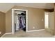 Bedroom closet with clothing racks and open doors to bedroom at 2415 Carina Nw Ter, Acworth, GA 30101