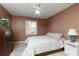Comfortable bedroom with hardwood floors, a dresser, and a nightstand at 2415 Carina Nw Ter, Acworth, GA 30101