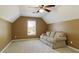 Spacious bonus room featuring a large sofa, and a sunny window at 2415 Carina Nw Ter, Acworth, GA 30101