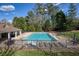 Relaxing community pool with lounge chairs and umbrellas, perfect for summer days at 2415 Carina Nw Ter, Acworth, GA 30101