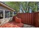Cozy deck features a wooden fence, offering a private outdoor space for relaxing and entertaining at 2415 Carina Nw Ter, Acworth, GA 30101