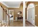 Inviting foyer with hardwood floors, archway accents, and natural light at 2415 Carina Nw Ter, Acworth, GA 30101