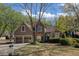 Charming home featuring a well-maintained lawn, a two-car garage, and tasteful landscaping at 2415 Carina Nw Ter, Acworth, GA 30101