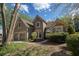 Charming home featuring a well-maintained lawn, a two-car garage, and tasteful landscaping at 2415 Carina Nw Ter, Acworth, GA 30101