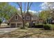 Charming home featuring a well-maintained lawn, a two-car garage, and tasteful landscaping at 2415 Carina Nw Ter, Acworth, GA 30101