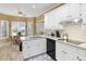 Bright kitchen featuring white cabinetry, granite countertops, and stainless steel appliances at 2415 Carina Nw Ter, Acworth, GA 30101