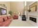 Spacious living room featuring a fireplace, neutral carpet, comfortable seating, and soaring ceilings for a grand and airy feel at 2415 Carina Nw Ter, Acworth, GA 30101
