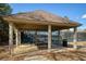 Covered pavilion with picnic tables next to tennis courts, ideal for gatherings and refreshments at 2415 Carina Nw Ter, Acworth, GA 30101