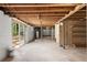 This unfinished basement features a sliding glass door exit and a large storage area at 6175 Knights Ln, Douglasville, GA 30135