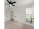 Bedroom with carpeted floors and multiple entryways to other rooms at 6175 Knights Ln, Douglasville, GA 30135