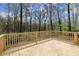 Newly constructed wooden deck overlooking a densely wooded lot at 6175 Knights Ln, Douglasville, GA 30135
