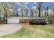 Charming single-story brick home featuring a well-maintained lawn and an attached two-car garage at 6175 Knights Ln, Douglasville, GA 30135