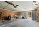 This spacious garage contains both a laundry area, garage door and storage room at 6175 Knights Ln, Douglasville, GA 30135