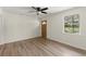 Bright, open-concept living space showcasing new wood-look floors and a ceiling fan at 6175 Knights Ln, Douglasville, GA 30135