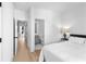 Neutral bedroom leading to a connected bathroom with geometric tiled floors at 699 Pryor Sw St # 4, Atlanta, GA 30315
