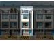 Modern townhome highlighted with multiple balconies, gray accents, and bright blue doors for a contemporary feel at 699 Pryor Sw St # 4, Atlanta, GA 30315