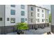 Modern townhome exterior featuring garages, private drive, and sleek architectural details at 699 Pryor Sw St # 4, Atlanta, GA 30315