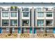 Modern townhome featuring multiple balconies, brick accents, and eye-catching blue doors for a contemporary look at 699 Pryor Sw St # 4, Atlanta, GA 30315