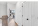 Light and bright hallway with wood floors leading to a bedroom at 699 Pryor Sw St # 4, Atlanta, GA 30315