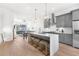 Modern kitchen with a large island, stainless steel appliances, and an open concept design to the living area at 699 Pryor Sw St # 4, Atlanta, GA 30315