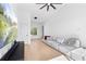 A comfortable, bright living room with hardwood floors, and a large television at 699 Pryor Sw St # 4, Atlanta, GA 30315