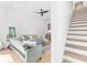 Bright living room with hardwood floors, modern furnishings, and staircase at 699 Pryor Sw St # 4, Atlanta, GA 30315