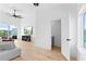 Bright living room with wood floors, a modern ceiling fan, and sliding glass doors to a patio at 699 Pryor Sw St # 4, Atlanta, GA 30315