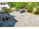 Paved parking area featuring modern pavers, landscaping, and parking for residents and visitors at 699 Pryor Sw St # 4, Atlanta, GA 30315
