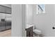 A small powder room adjacent to a modern kitchen at 699 Pryor Sw St # 4, Atlanta, GA 30315