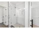 Contemporary shower featuring white subway tile walls, glass door, and hexagon tile flooring at 699 Pryor Sw St # 4, Atlanta, GA 30315