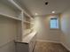Finished basement features cabinets and a countertop, perfect for a home office or hobby area at 802 Crow View Ct, Woodstock, GA 30189