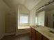 Bright bathroom with a large soaking tub, shower, and double sink vanity for added convenience at 802 Crow View Ct, Woodstock, GA 30189