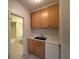 Bathroom features a sink, toilet, and tub with tiled floors at 802 Crow View Ct, Woodstock, GA 30189