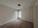 Comfortable bedroom with a large window, offering plenty of natural light at 802 Crow View Ct, Woodstock, GA 30189
